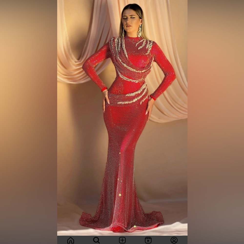 Red evening gown from an Albanian designer, Ari & Art.